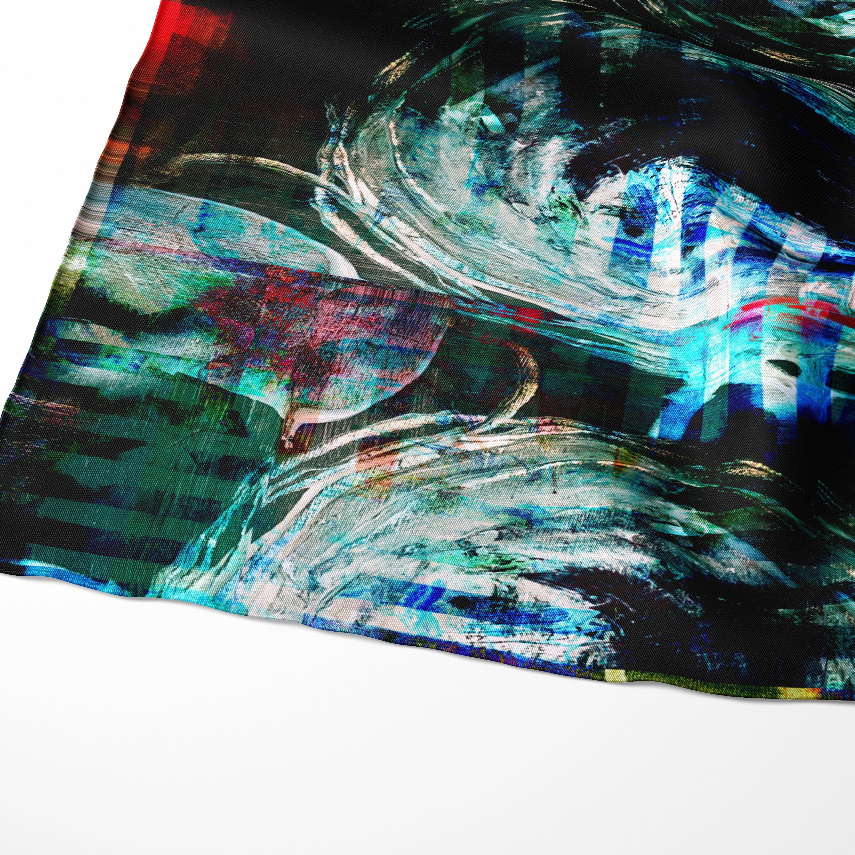 detail of an abstract printed Aurelio Costarella silk scarf in tones on blue, purple, black and red. printed onto a semi transparent fine smotth silk cotton bland fabric